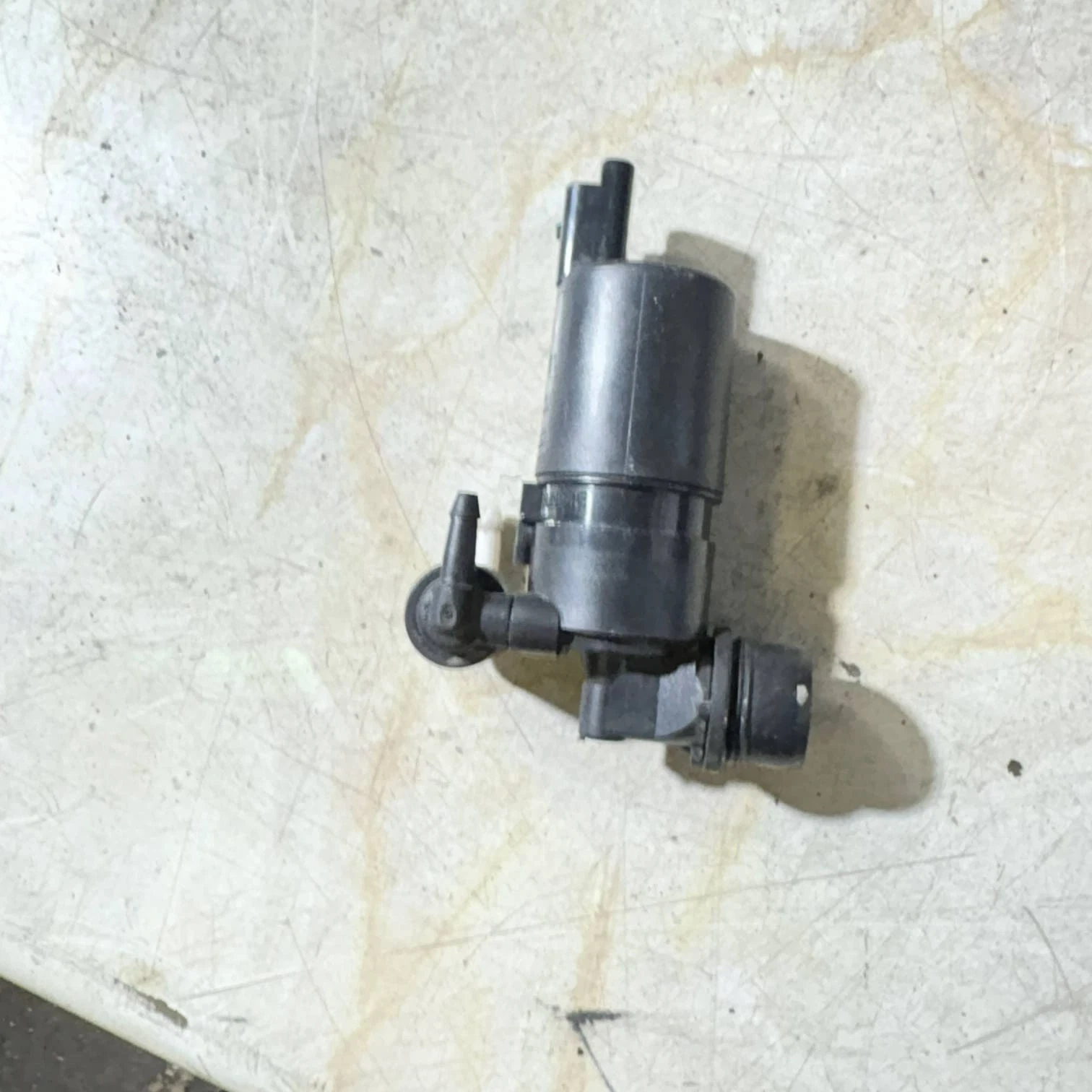 Actual washer pump side view