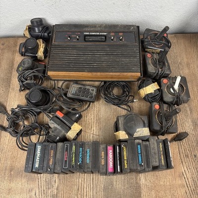 Atari 2600 Game Console W/ Controls & 20 Games w/ paddles & joysticks Untested