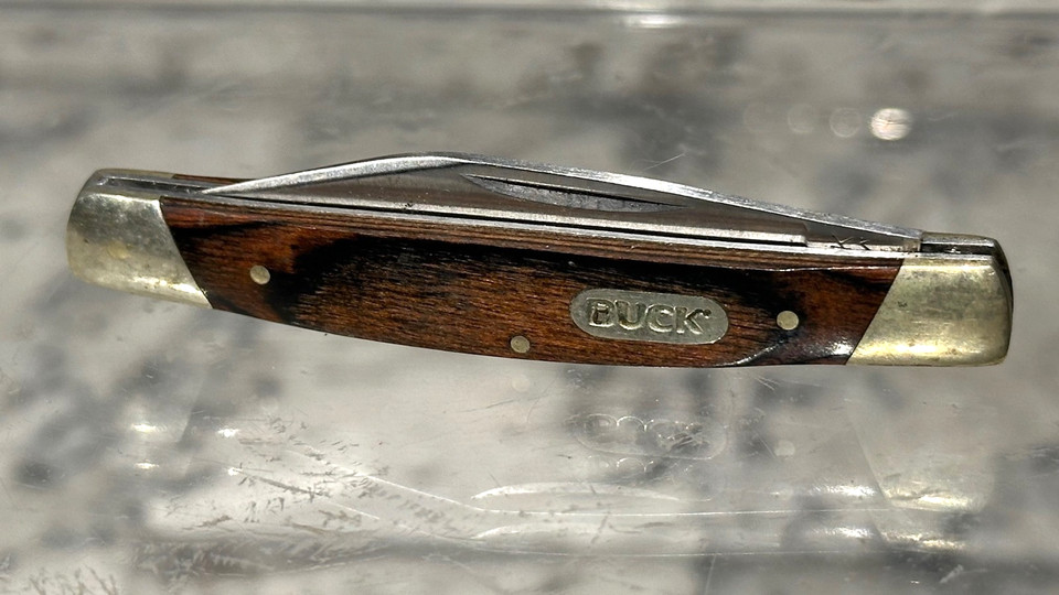 An authentic vintage Buck 379 — a legendary American-made folding knife brand that's been a rite-of-passage gift for generations of outdoorsmen.