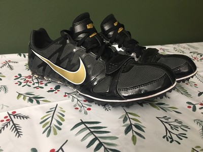 black and gold track shoes