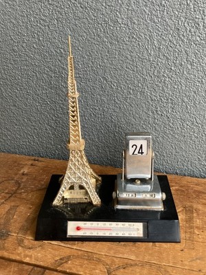 Mid century Eiffel Tower flip day/date calendar plus Chinese characters.M