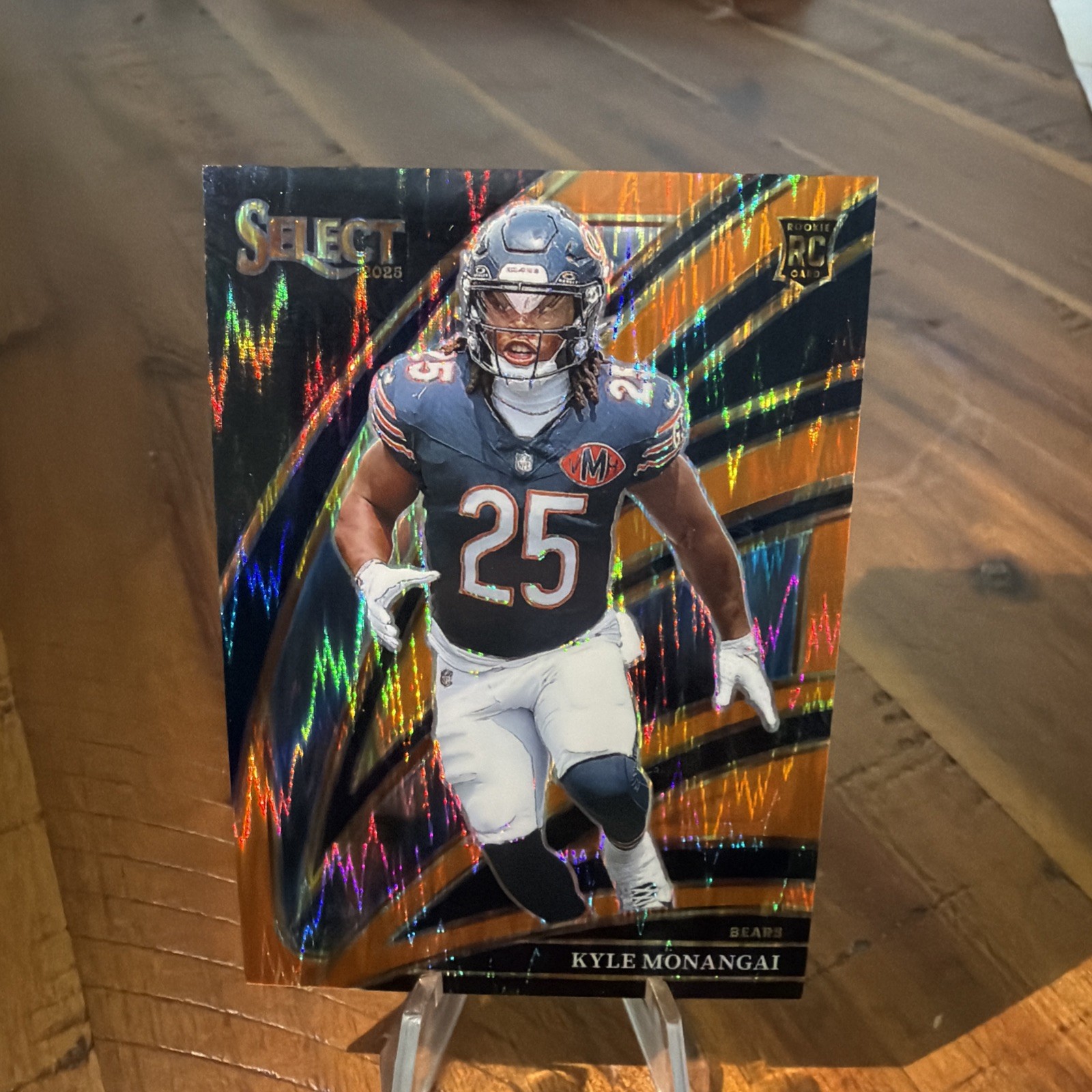 2025 Panini Select Kyle Monangai 274 Club Level Orange Prizm Shock  182/399 (RC)