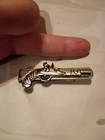 Silver Money Clip Showing A Gun — photo 4