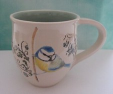 Hand painted blue tit on twig with floral detail, cream/aqua mug, Bali Edwards