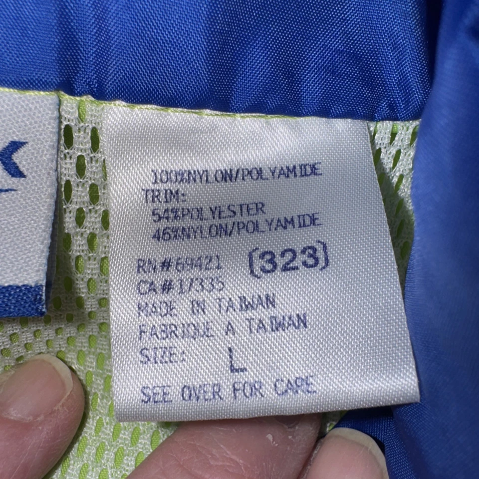 Chaqueta cortavientos vintage Reebok cremallera completa bloque de color años 90 abrigo grande para hombre Foto 3 de 4
