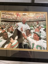 The photograph shows Don Shula, the legendary former coach of the Miami Dolphins