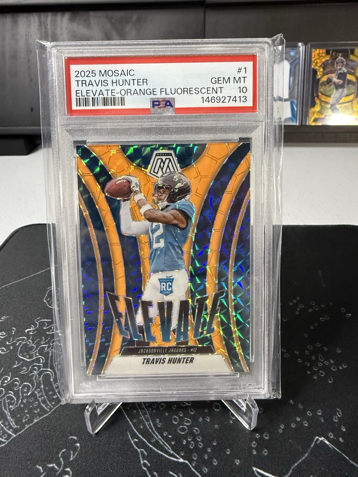 2025 Panini Mosaic Elevate Travis Hunter #1 Orange Fluorescent (RC) PSA 10