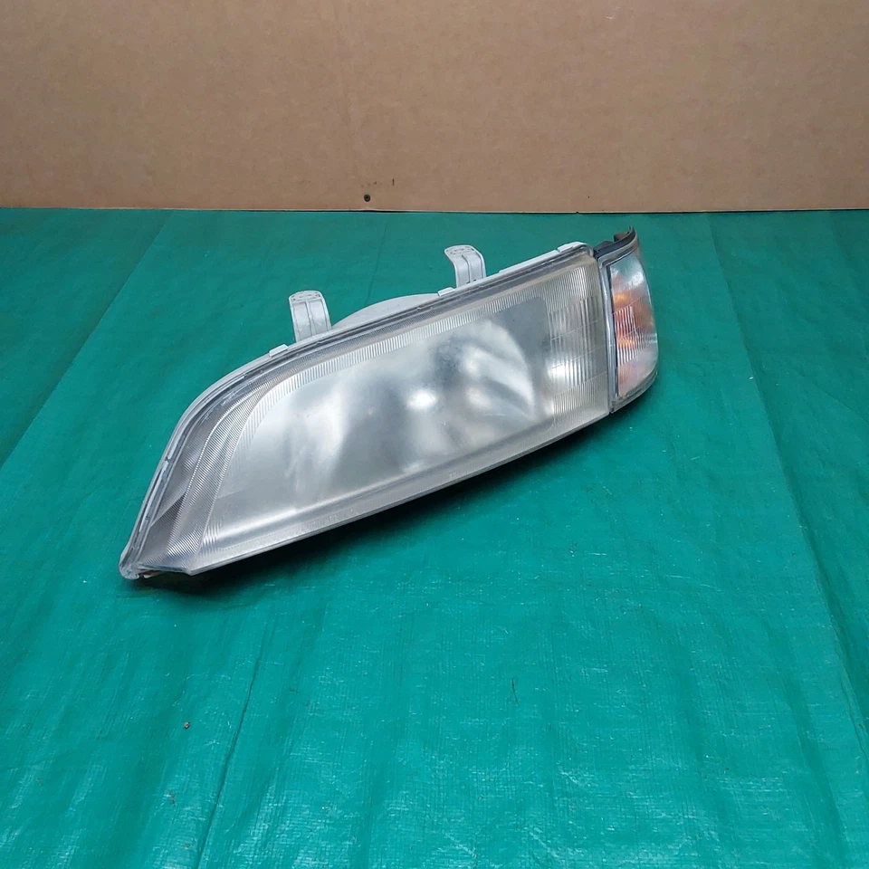 Faro halógeno lateral izquierdo Infiniti G20 1999-2002 OEM 26065-7J100 Foto 2 de 4