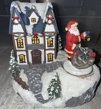 Astralis Christmas House with Turning Santa Figurine