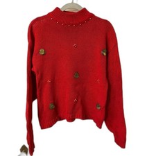 Red mock-neck sweater with coin embellishments
