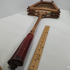 Vintage wooden badminton rackets branded "RED BY Sportcraft" and a wooden sieve