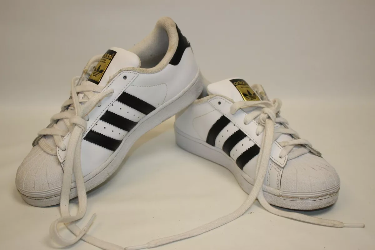 White and gold top shell toe adidas