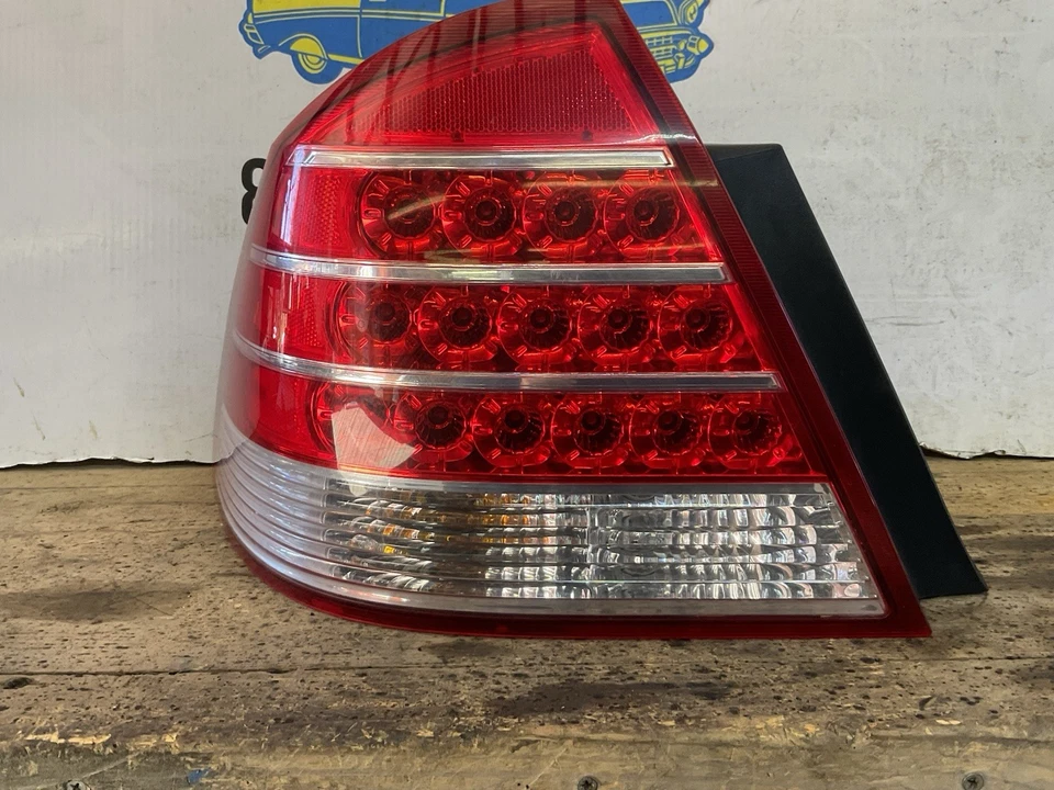 Conjunto de luz trasera lateral izquierda Mercury Montego 2005-2007 con arnés pieza OEM Foto 4 de 4