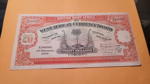 British west Africa note with a tear at the center top