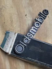1970s Nos Oldsmobile Grille Emblem Name Plate Badge Gm Part Number 556872