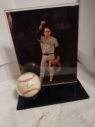 Nolan Ryan Autographed Baseball With Picture Display Stand.