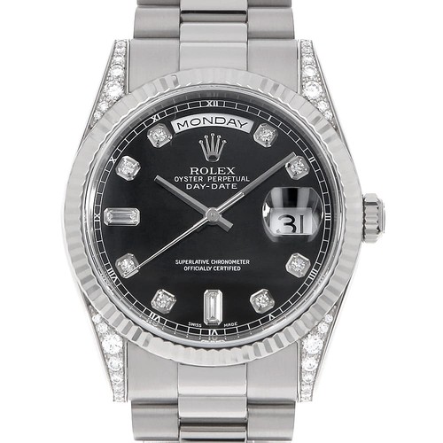 ROLEX Day-Date with diamond lugs, 8 diamonds, and 2 baguette diamonds. 11833...