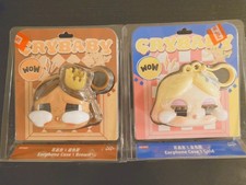 Pop Mart Crybaby Shiny Shiny Series Earphone Cases in brown and gold variants.