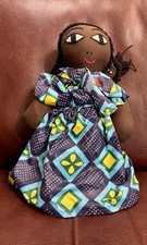 A handcrafted rag doll depicting a mother and child in African Print