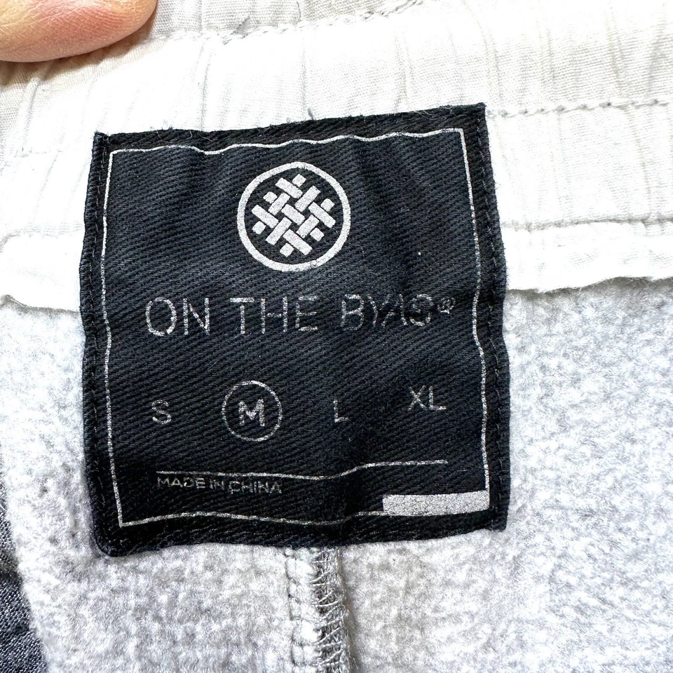 Pantalones deportivos Jogger talla mediana para hombre gris cintura elástica bolsillos con cremallera en el byas Foto 4 de 4