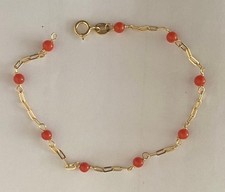 18 kt Gelbgold Koralle - Wahre Korallentaufe