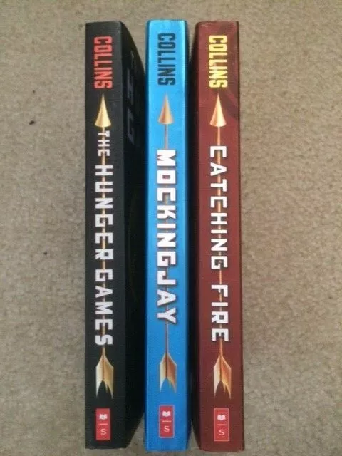 The Hunger Games Trilogy with Pin (Hunger Games / Catching Fire /  Mockingjay) - Suzanne Collins: 9780545374095 - AbeBooks