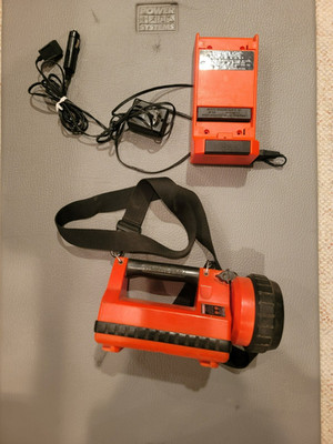 Stream Light Litebox Flashlight with shoulder strap, AC charger & DC charger.