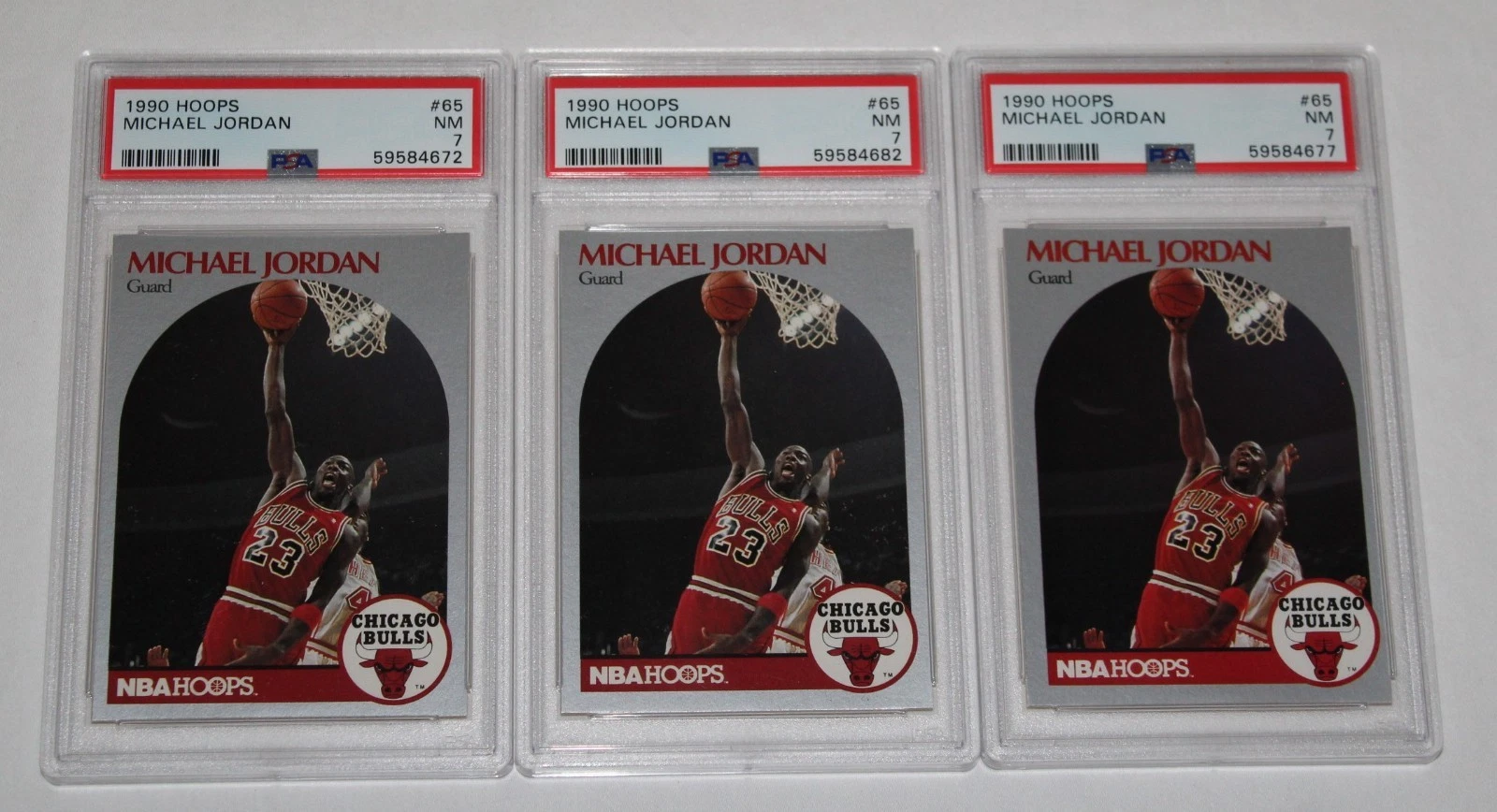THREE (3) 1990 Hoops Basketball Card #65 MICHAEL JORDAN Bulls Graded PSA 7 NM