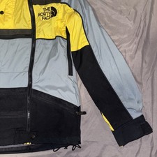 Preços baixos em The North Face Amarelo Corta-vento Casacos