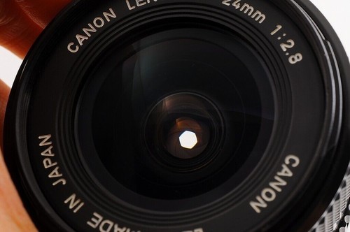 【CASI COMO NUEVO+】CANON NEW FD NFD 24mm F/2.8 MF Lens Cap + 1984 OLYMPIC... - Imagen 10 de 12