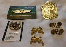 LOT OF 7 FOREIGN MILITARY METAL  INSIGNIAS FROM "AMERICAN MADE" TOM CRUISE!