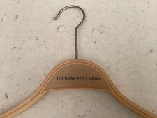 Six wooden mid-century international five star hotel coat hangers
