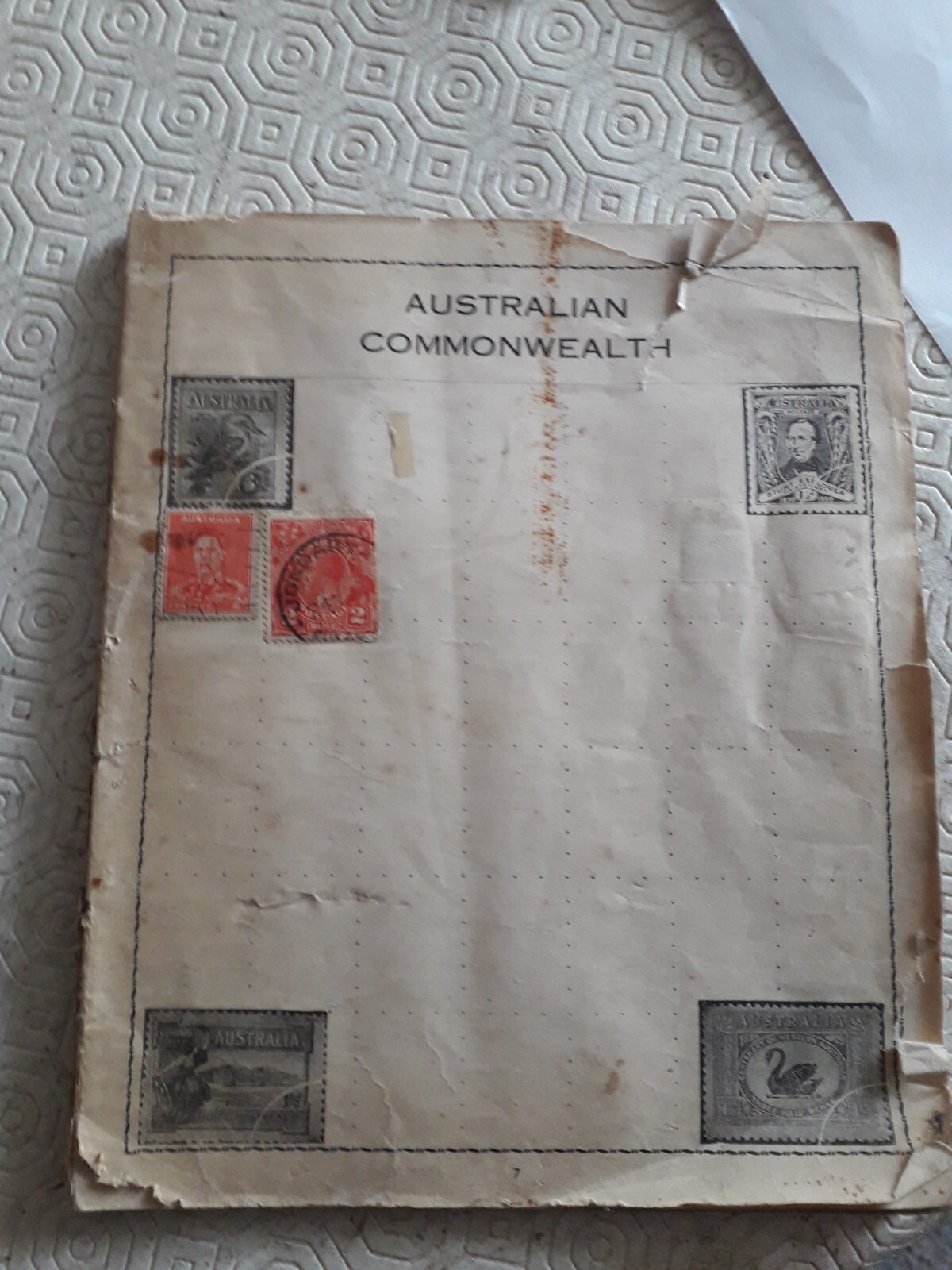 Old Stamp Album with various country stamps (Estimated 300 old to