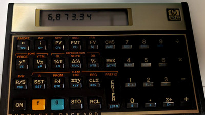 HP 12C Platinum Financial Calculator with original HP leather slip case Tested