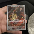 Team Rocket’s Meowth 203/182 Sv10: Destined Rivals Illustration Rare Holo