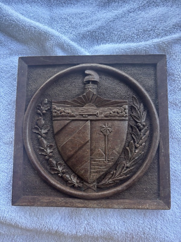 Authentic hand-carved wooden crest for a Havana humidor lid.