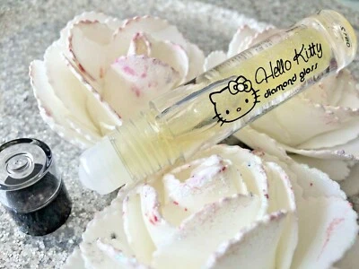HELLO KITTY Gloss De Labios Transparente Con Pailletes 2,5ml Nuevo - Imagen 1 de 3