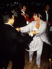 Actress Elizabeth Taylor dancing film producer Hank Moonjean durin- Old Photo