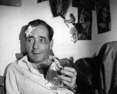 Humphrey Bogart worse for wear holding wine glass Barefoot Contessa 8x10 photo
