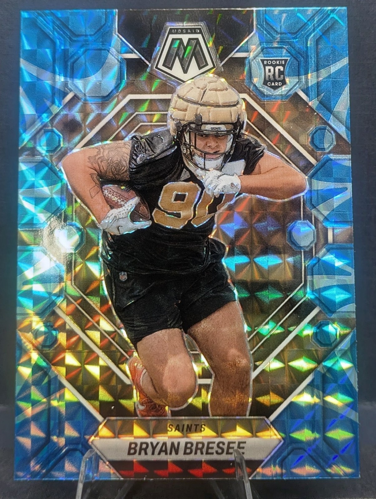 2023 Panini Mosaic Rookies Bryan Bresee #289 Reactive Blue Mosaic (RC) Saints