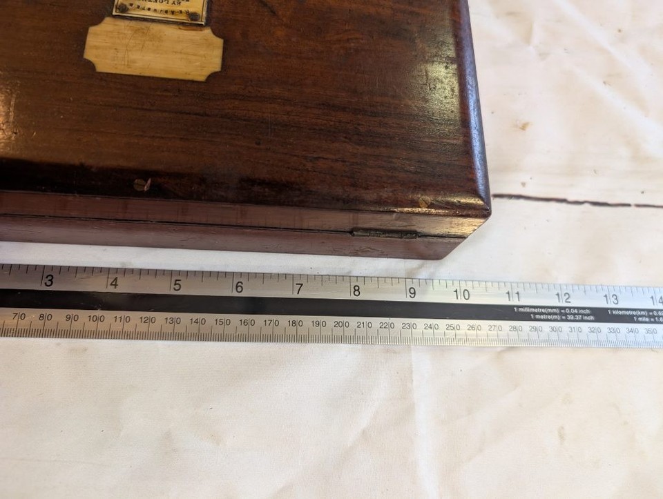 A complete antique hydrometer set in a velvet-lined mahogany case — the kind of scientific instrument that looks like it belongs in a Victorian apothecary.