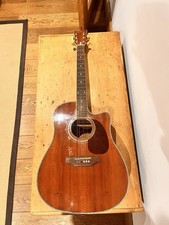 It Is A JayTurser Acoustic Guitar Ok Condition Missing A String And A ScrewPlate
