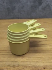 TUPPERWARE Set  of  4   Nesting Measuring Cup   USA  Gold / Yellow