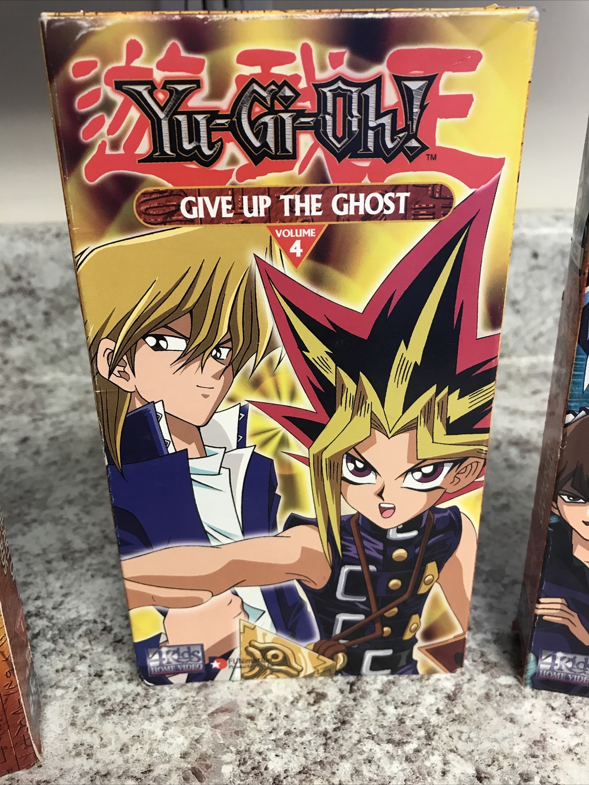3 YuGiOh VHS Tapes 1 The Heart of the Cards 4 Give Up Ghost 6 Scars
