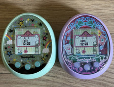Tamagotchi ON green fairy magic and Tamagotchi ON purple Wondergarden WORKING