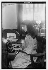Photo:Sally Hamlin Seated at Typewriter Portrait thumbnail