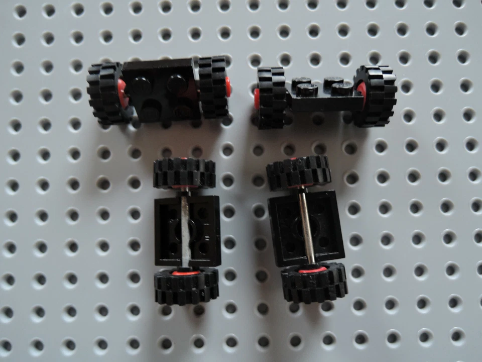 Lego 4 x Achse 122c01assy2 2x2 schwarz Metallstange Felge rot 590 6377 374 558 - Bild 1 von 1