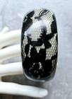 VTG 80'S LUCITE BANGLE BRACELET BLACK FLORAL LACE INCLUSION CREAM BASE CLEAR TOP — photo 1