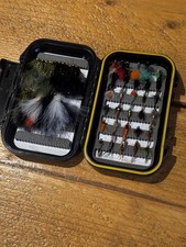 A FLY BOX WITH FLIES AS PICTURED BOX 5.5" × 3" GOOD FLIES READY TO FISH WITH.