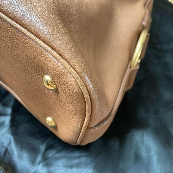 Yves Saint Laurent Muse cammello 17 7 pollici 40